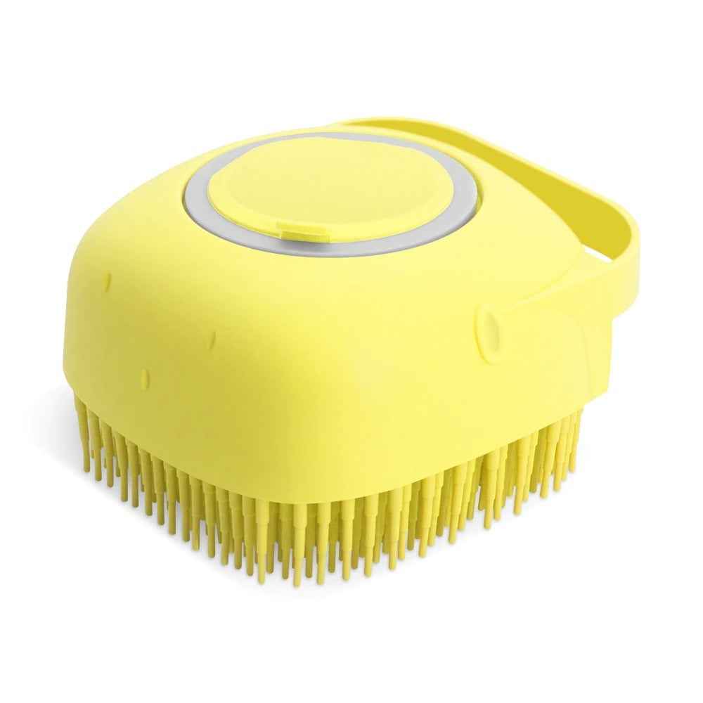 Pet Grooming Massager Brush being filled with pet shampoo for optimal grooming. - Whiskerwise